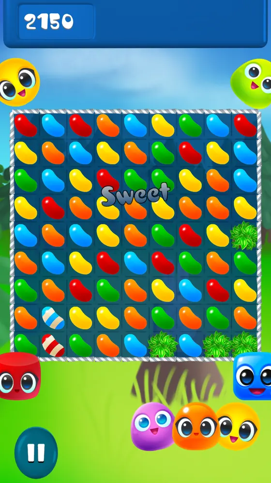 Match 3 Candy board filled with coloured candies and small creature characters below